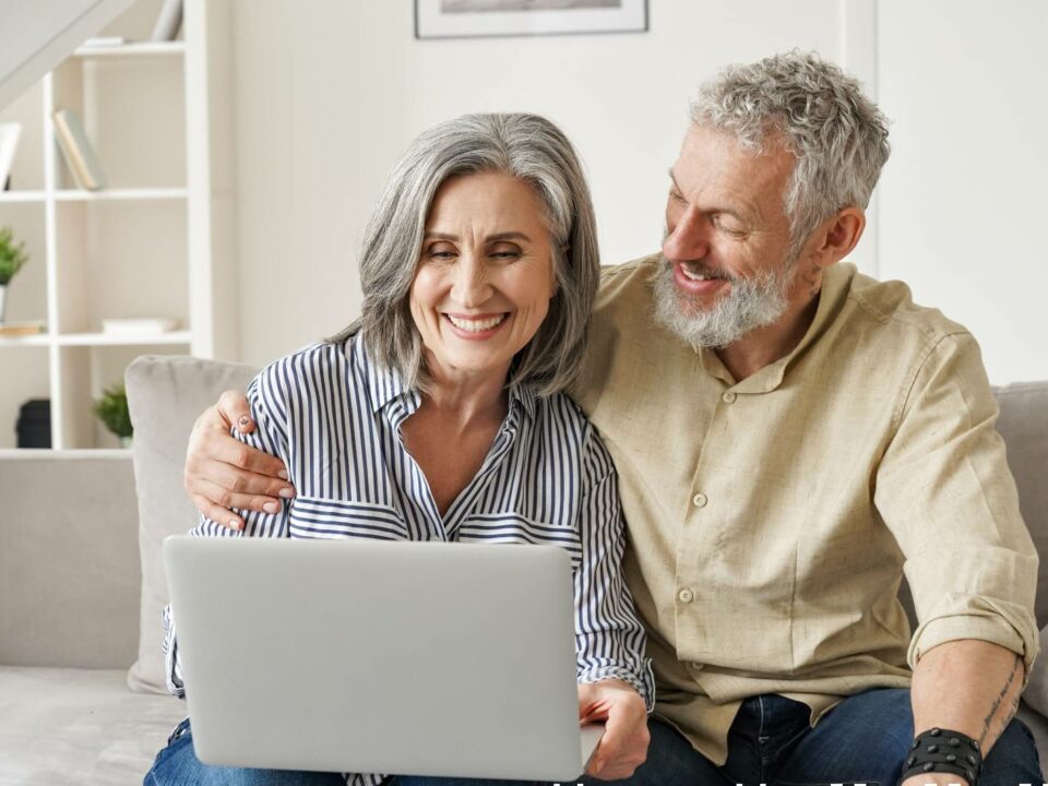 senior couple looking at a laptop together looking for senior living options