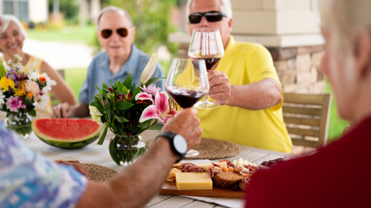 Friendship Village residents at a wine and cheese tasting event