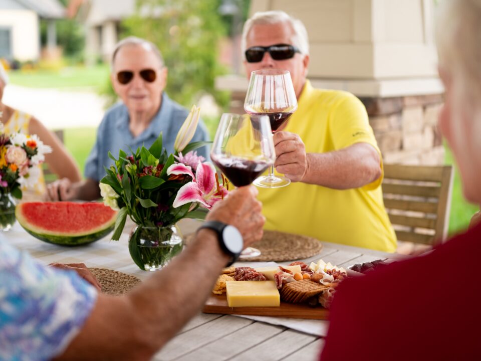 Friendship Village residents at a wine and cheese tasting event