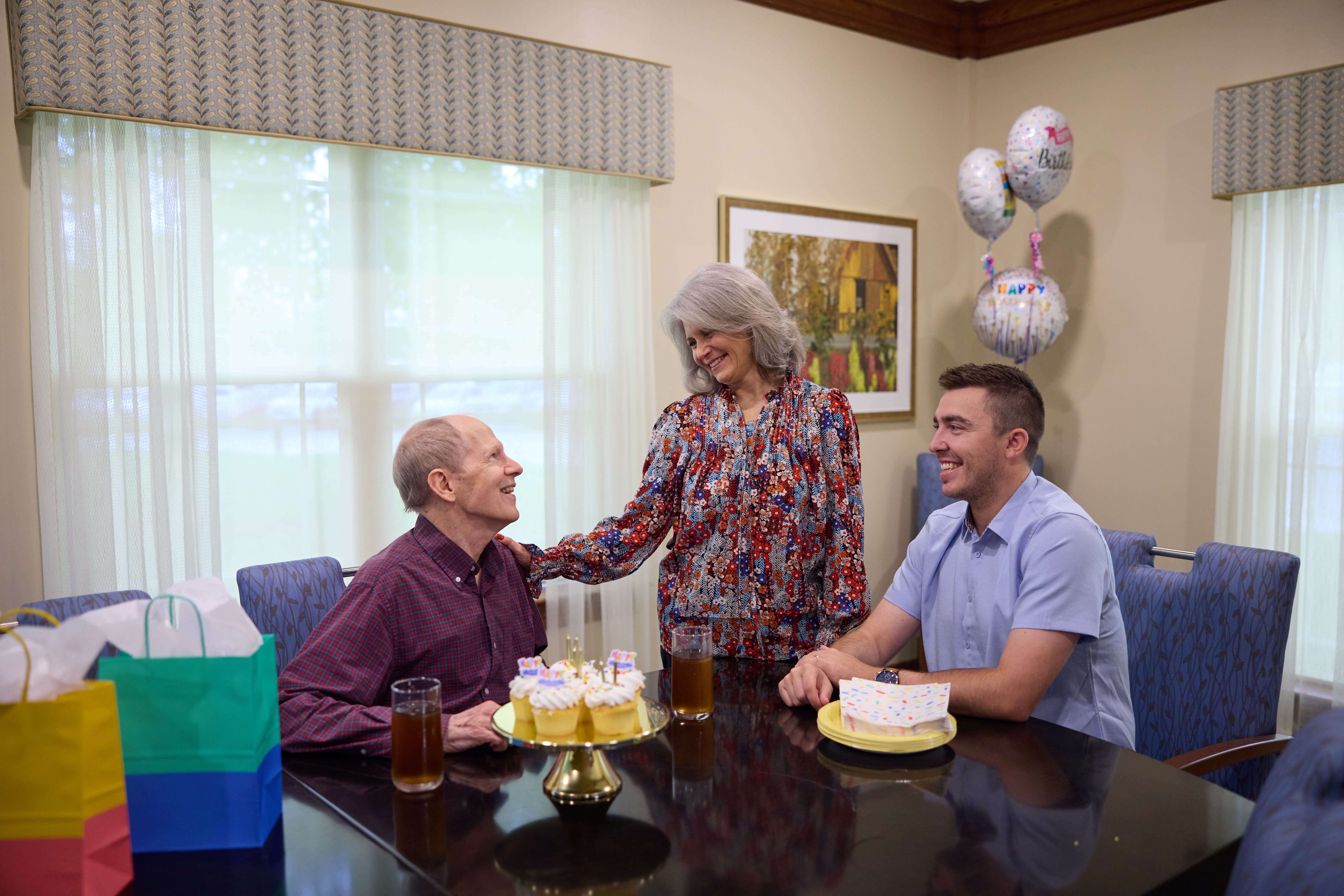 A senior living resident and their family during a birthday celebration