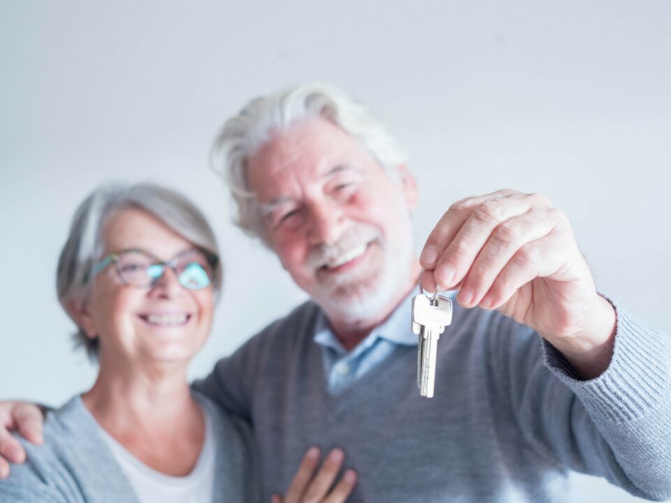 Senior couple holding a set of keys